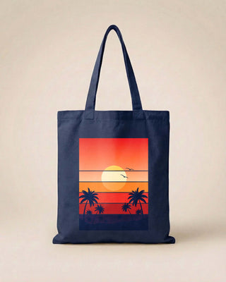 Navy tote bag with a sunset and palm tree design on a beige background
