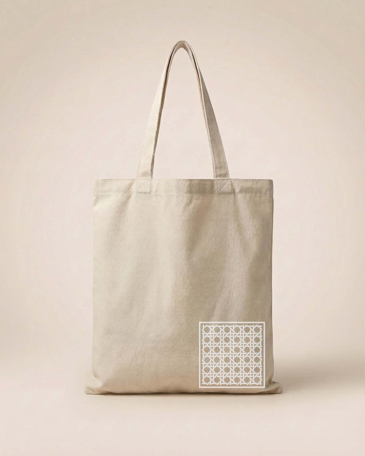 Beige tote bag with a geometric pattern on a beige background